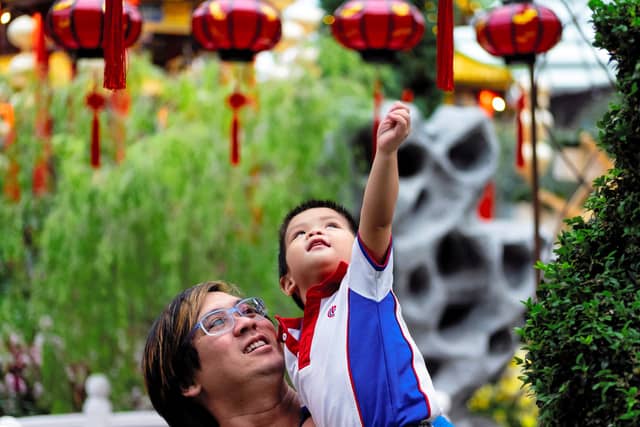 Freedom of Choice for Order of Surname and Given Name, and For Husband and Wife to Have Different Surnames, But What About Countries With Patriarchy Systems? 1 father and son celebrating lunar new year