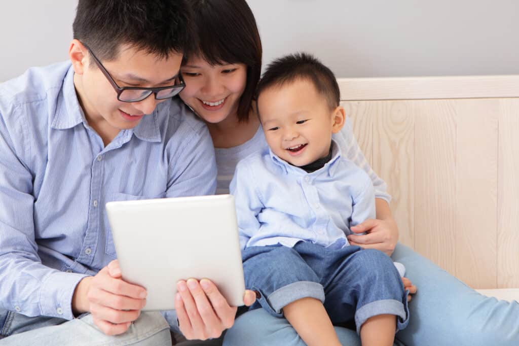 happy family using tablet pc